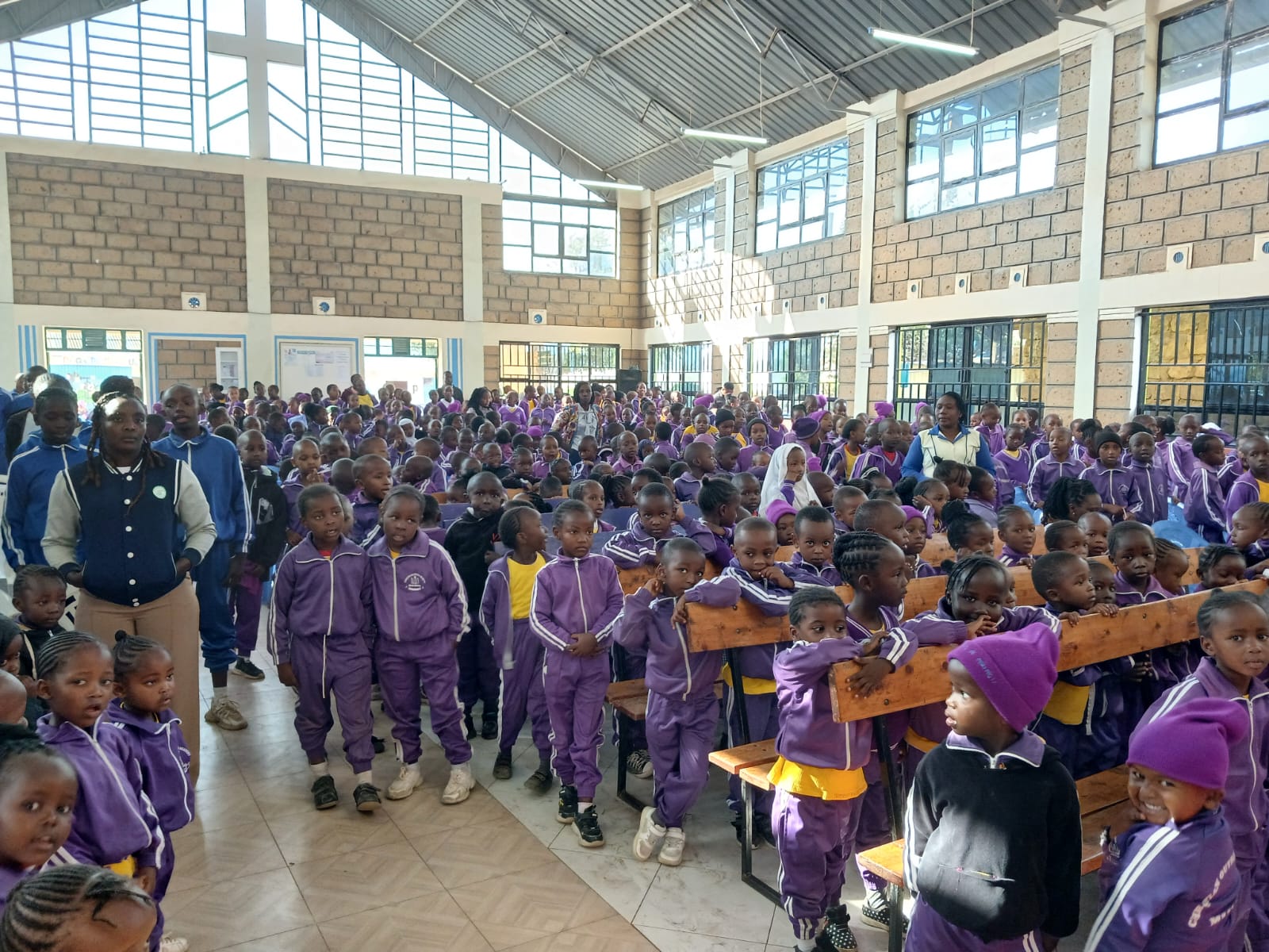 Learners and teachers gathered inside the school hall