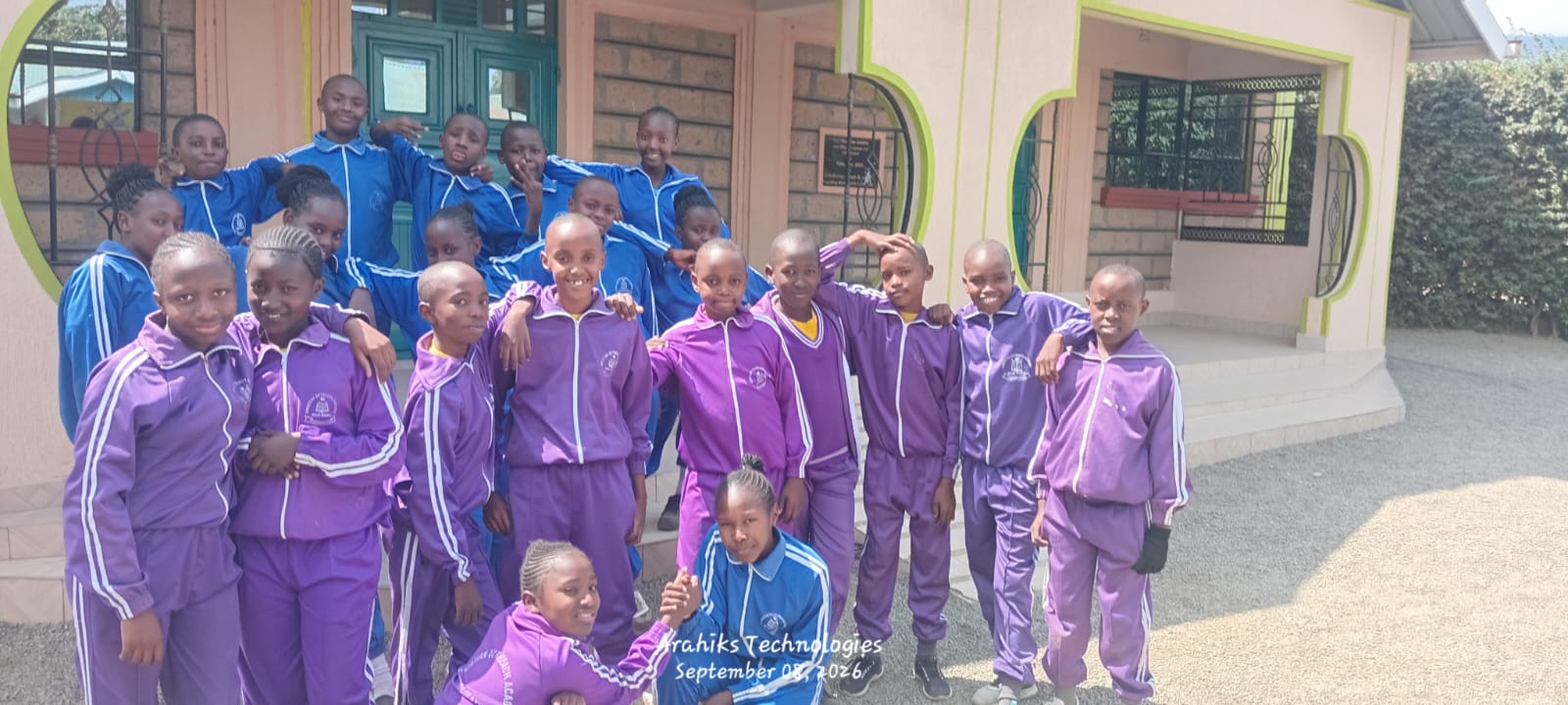 Learners in purple and blue tracksuits together