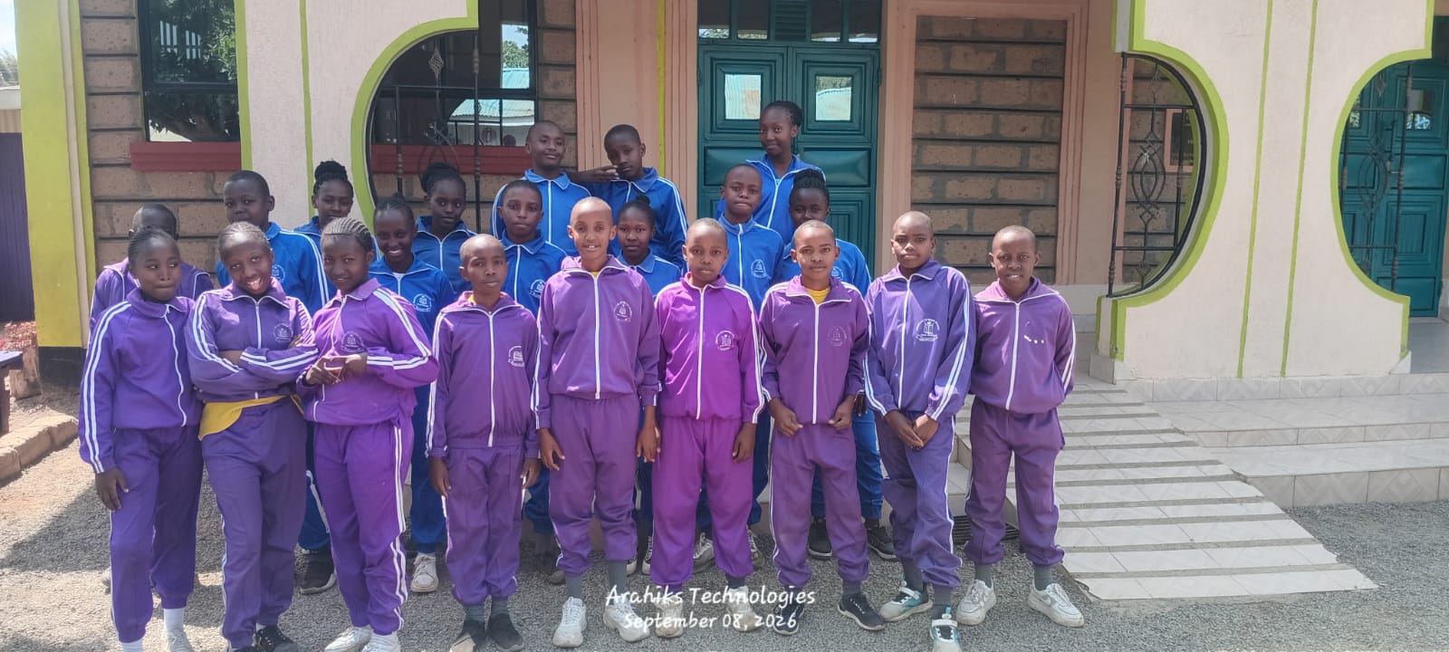 Learners of Christian Outreach Academy Maai Mahiu in front of the school