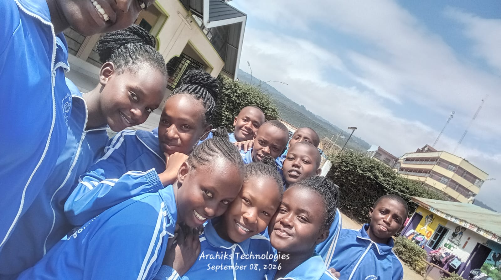 Smiling learners in blue tracksuits